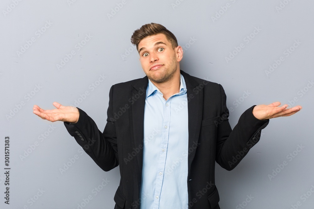 Young handsome caucasian man funny and friendly sticking out tongue. Young handsome caucasian man funny and friendly sticking out tongue.