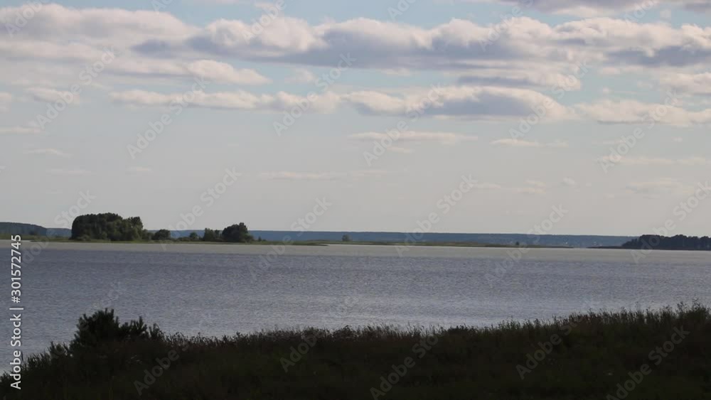 Summer, river, grass, sky and clouds Summer, river, grass, sky and clouds