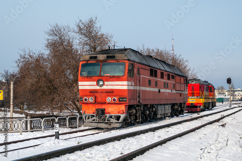 Passenger locomotive TEP70-0564 and shunting locomotive ChME3-3120 at the station Cheboksary of Gorky Railway, Cheboksary, Russian Federation