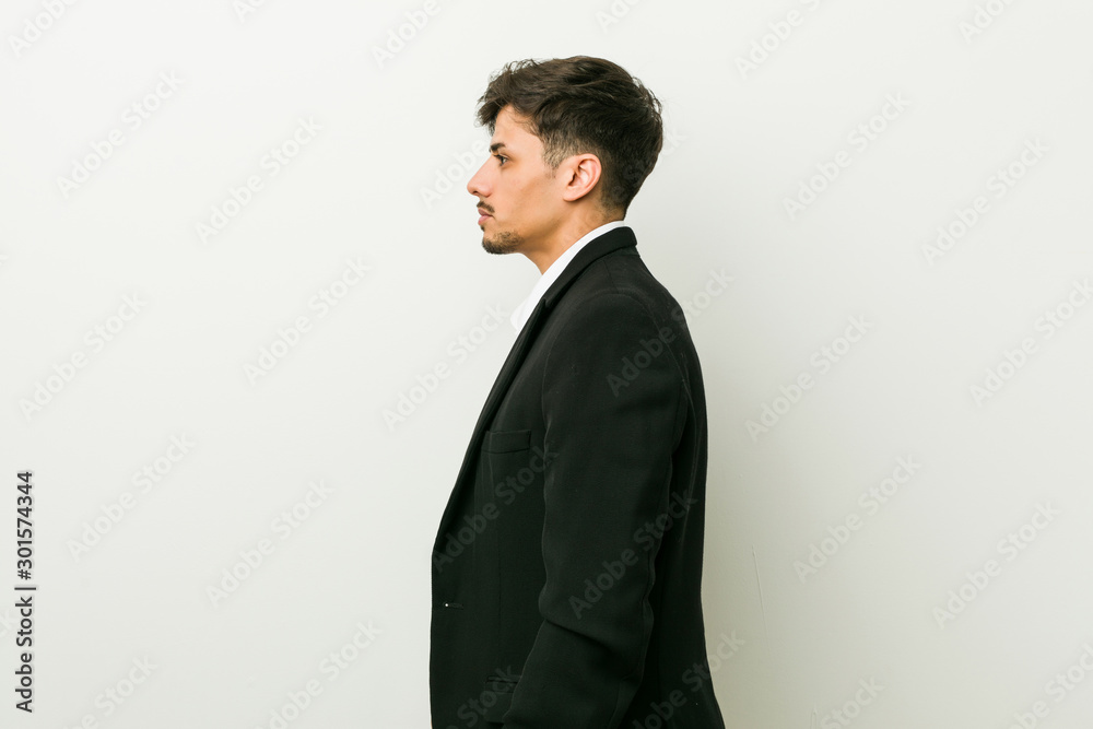 Young business hispanic man gazing left, sideways pose. Young business hispanic man gazing left, sideways pose.