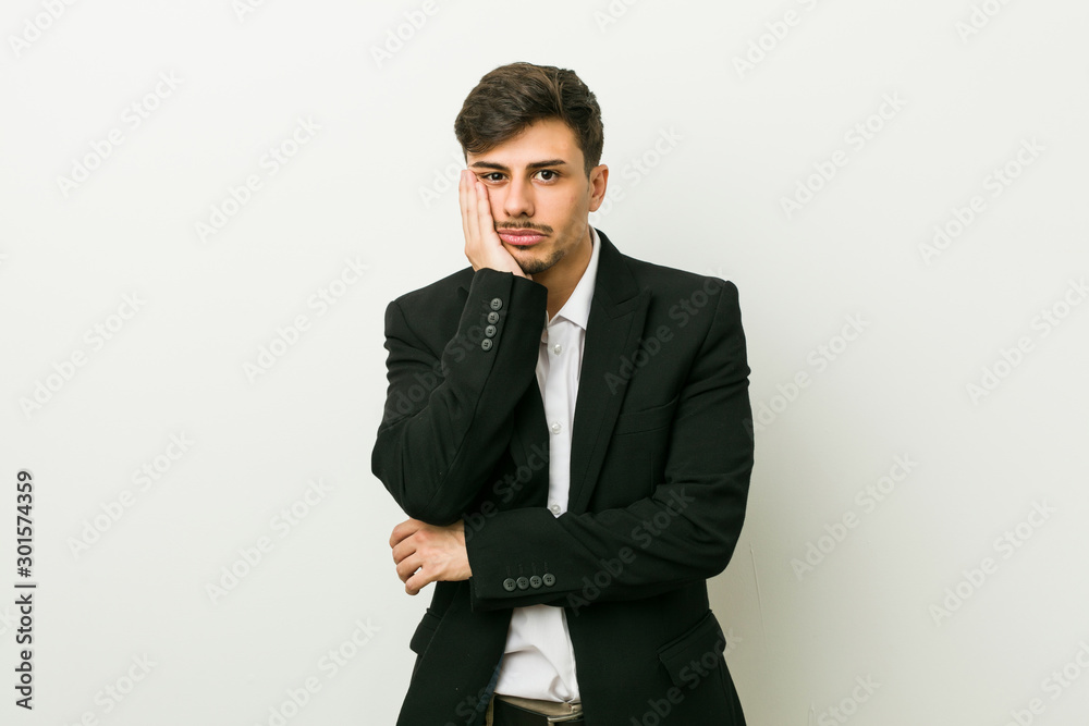 Young business hispanic man who is bored, fatigued and need a relax day. Young business hispanic man who is bored, fatigued and need a relax day.