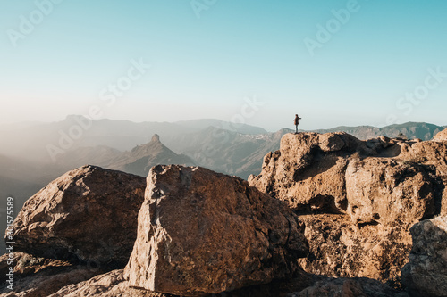boy alone on top of the mountain