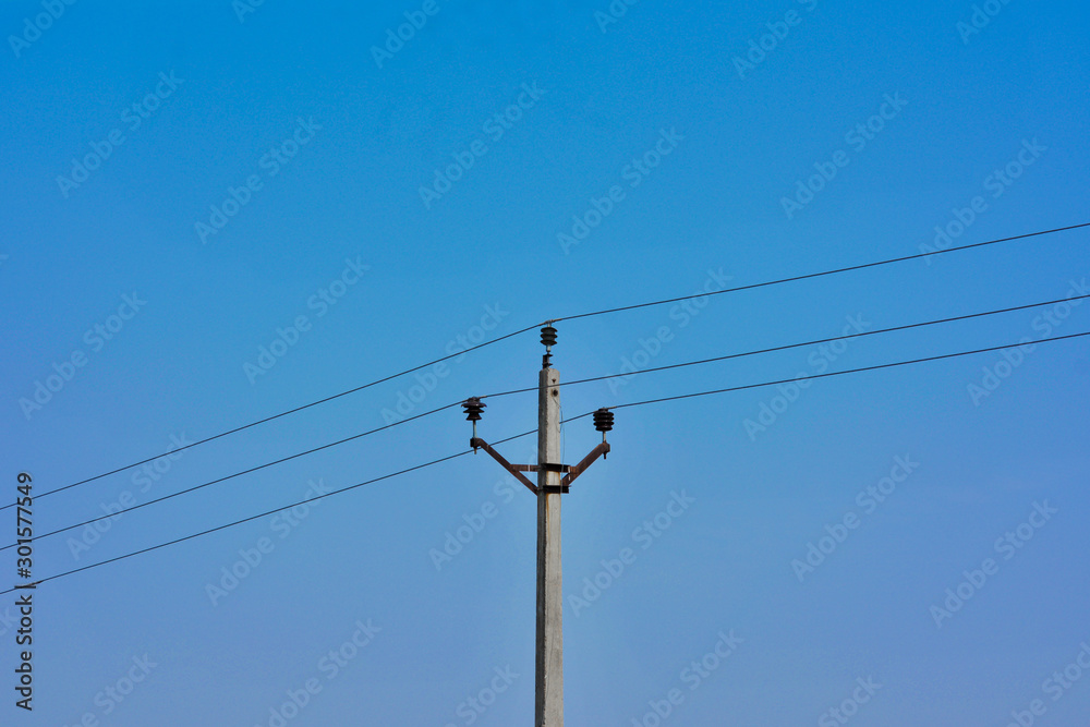 Concrete electric pole with blue sky background Concrete electric pole with blue sky background