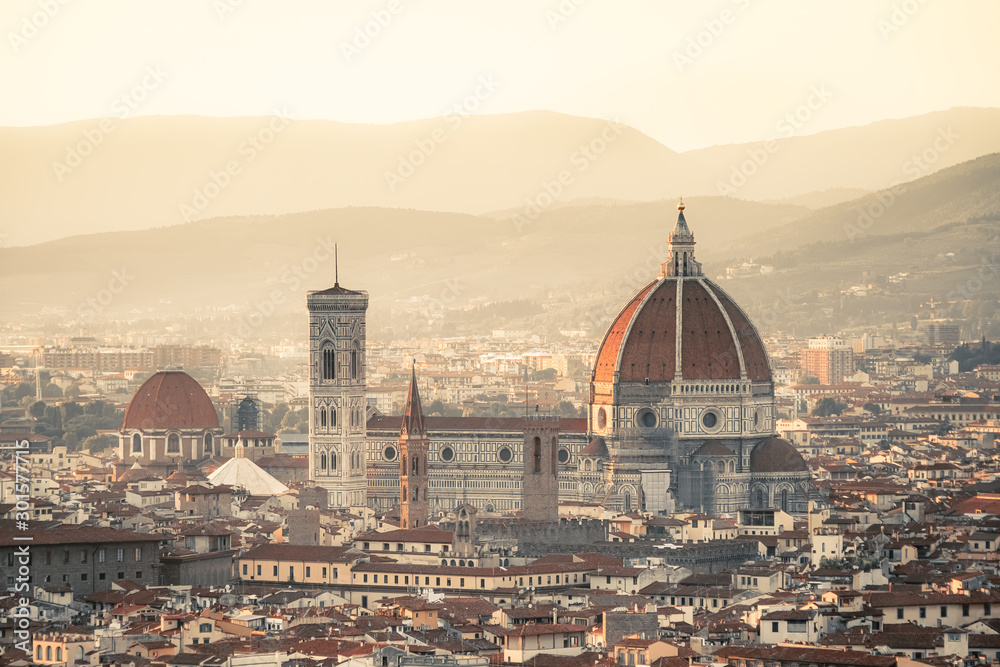 Pink and orange dawn over the city of Florence. Aquarelle toned sunrise. Travel destination Tuscany, Italy