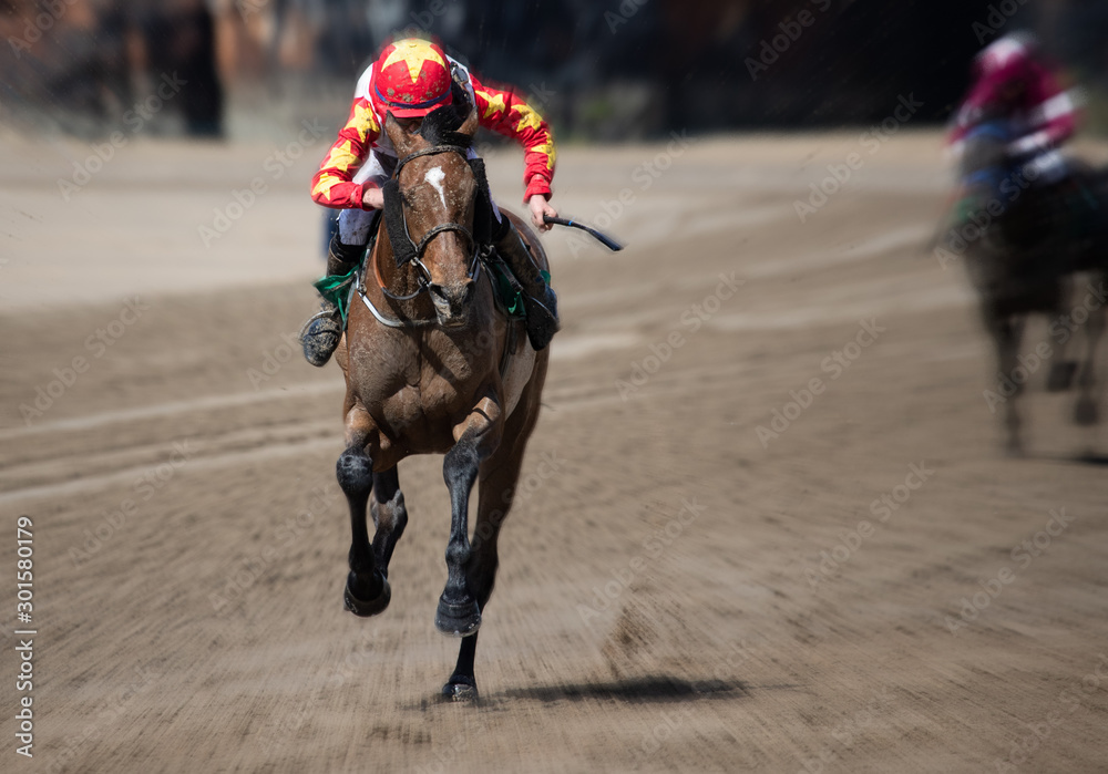 Lead race horse and jockey sprinting towards the finish line, horse racing on the beach, motion blur speed effect Lead race horse and jockey sprinting towards the finish line, horse racing on the beach, motion blur speed effect