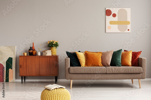 Retro style in beautiful living room interior with grey empty wall photo