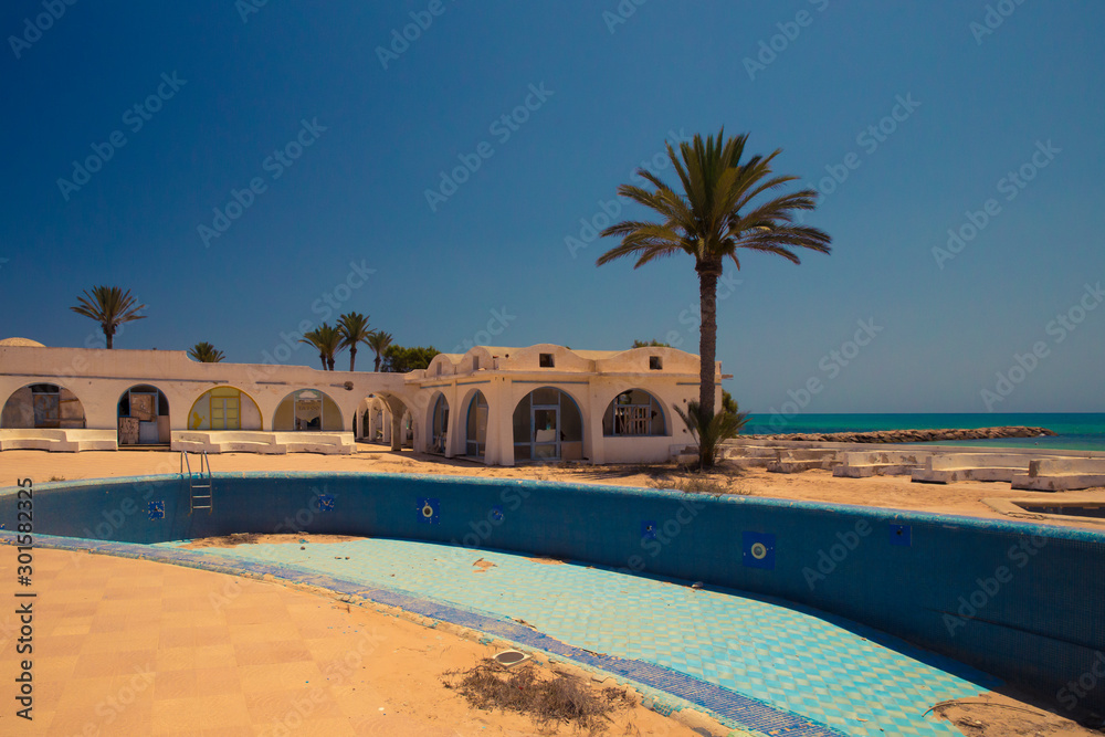 Landscape of a destroyed and abandoned resort in Djerba, Tunisia caused by independence.