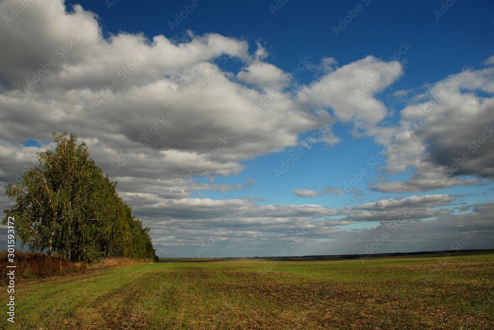 clouds over a sloping field clouds over a sloping field