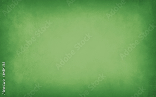 Green background with soft blurred marbled texture grunge on borders, old vin...