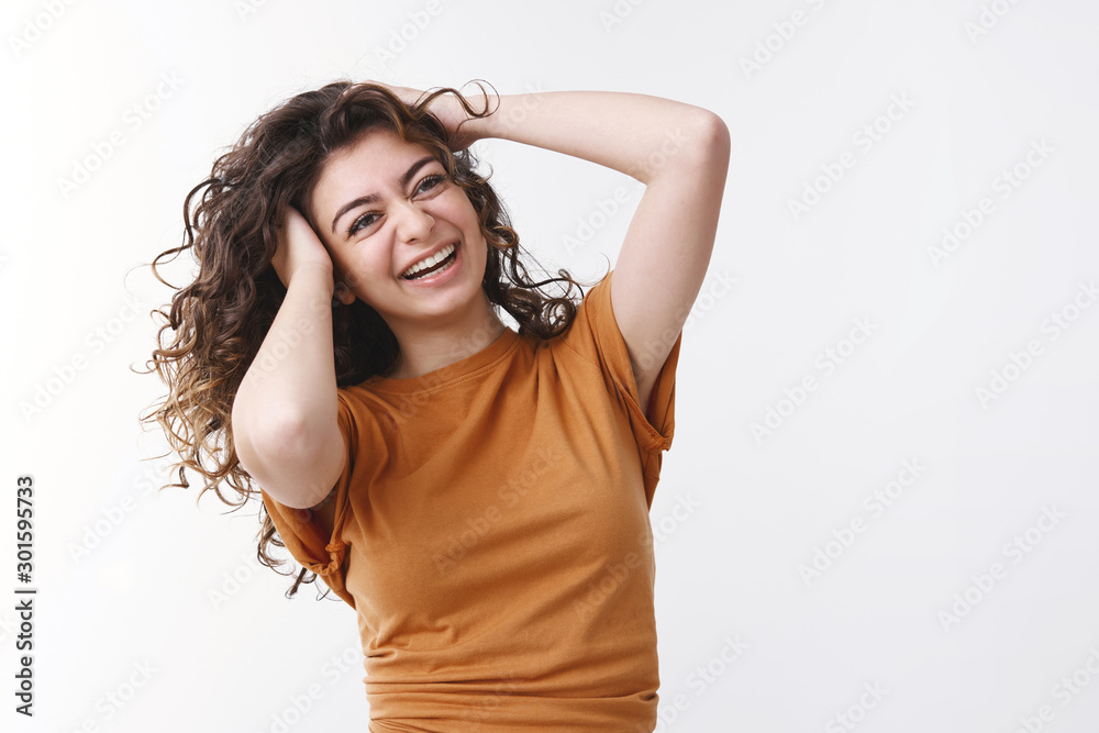 Joyful charismatic smiling lucky young caucasian girl black curly hair shaking head playing hairstyle laughing happily promoting haircare products feel lucky good mood perfect day have fun Joyful charismatic smiling lucky young caucasian girl black curly hair shaking head playing hairstyle laughing happily promoting haircare products feel lucky good mood perfect day have fun