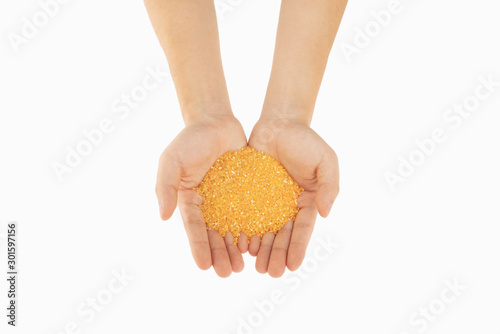 corn flour in hands with white background