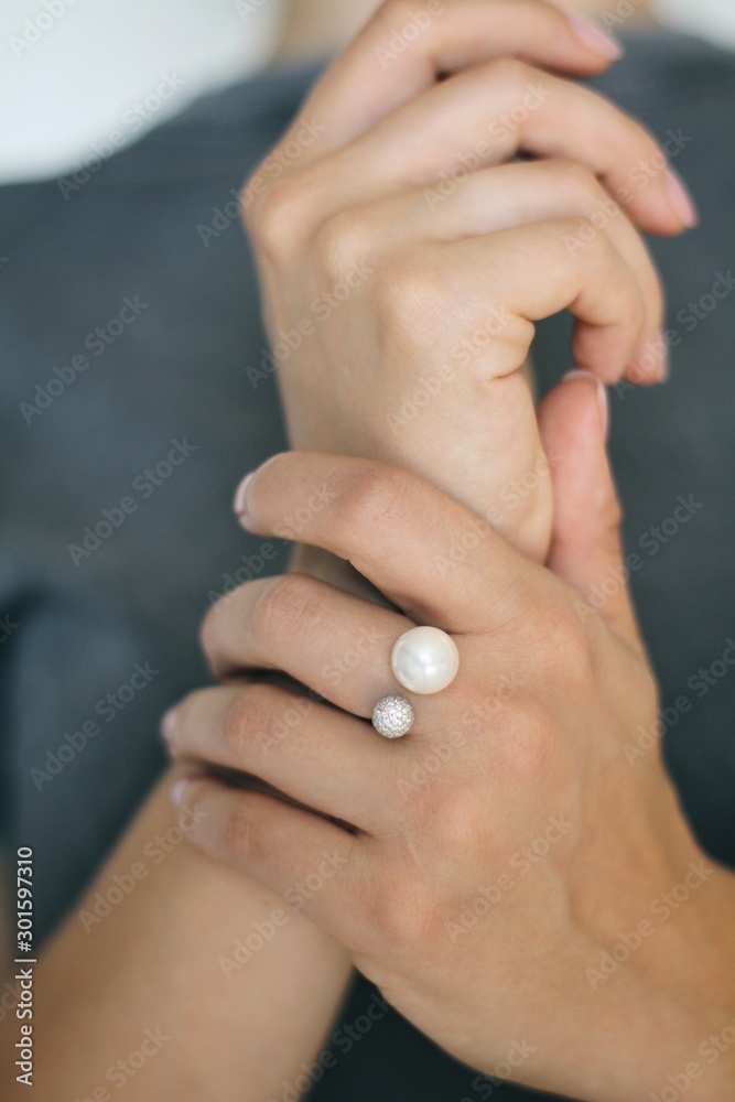 Tender jewerly on female hand, close up shot
