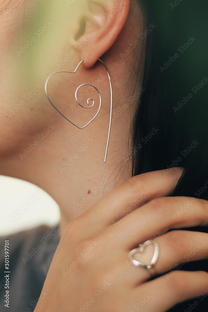 Tender jewerly for female ears, close up shot