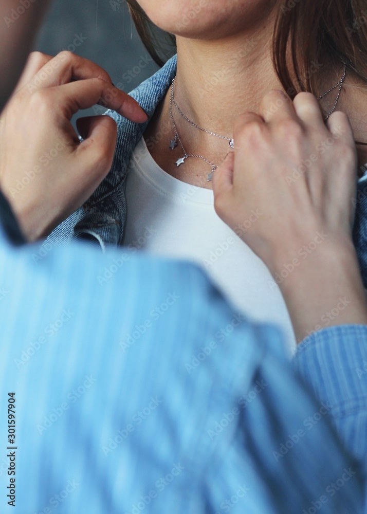 Tender jewerly on female neck, close up shot