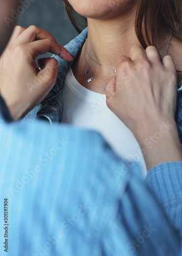 Tender jewerly on female neck  close up shot