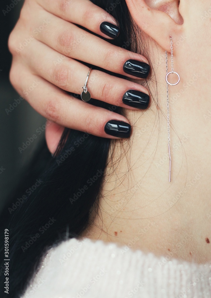 Tender jewerly for female ears, close up shot