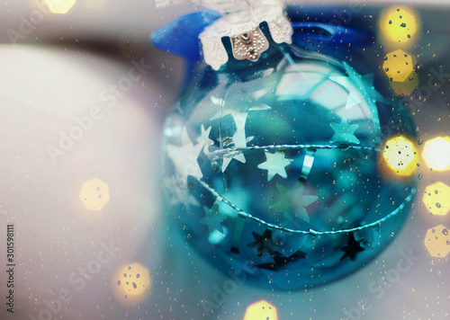Fototapeta Naklejka Na Ścianę i Meble -  blurred background with Christmas toy in blue color with stars, clear decorative bowl