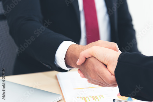 Businessman and businesswomen hand shake after businesss agreement, meeting.
