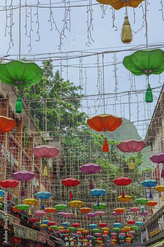 Walking under street decoration in Yangshuo near Guilin photo