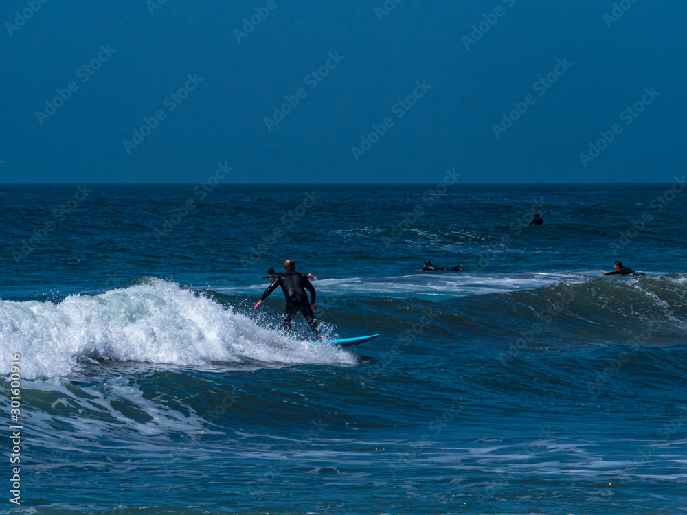 California Surfer and his turquoise Board enjoy the sea California Surfer and his turquoise Board enjoy the sea