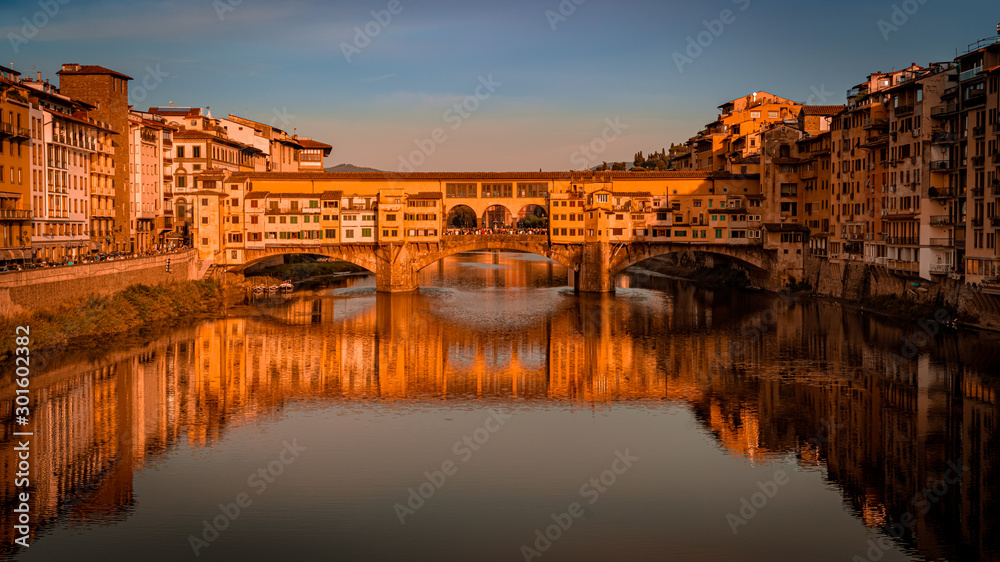 Ponte Vecchio bridge in Florence at sunset. Travel destination Tuscany, Italy