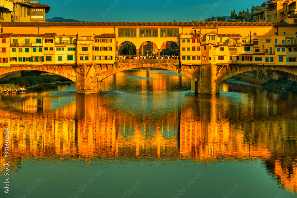 Ponte Vecchio bridge in Florence at sunset. Travel destination Tuscany, Italy