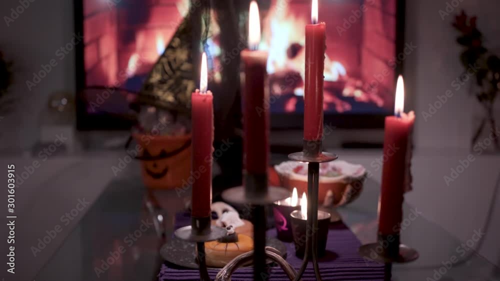 Halloween decorated table dark moody style with scary accessories rack focusing camera Halloween decorated table dark moody style with scary accessories rack focusing camera