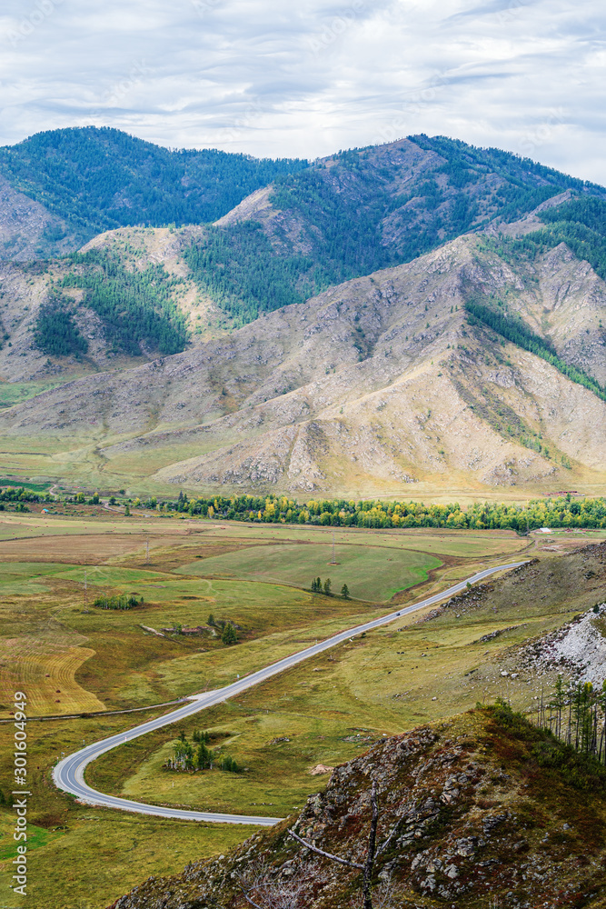 Serpentine mountain road. View of the Chuysky tract from the Chike-Taman pass, Altai mountains, Russia