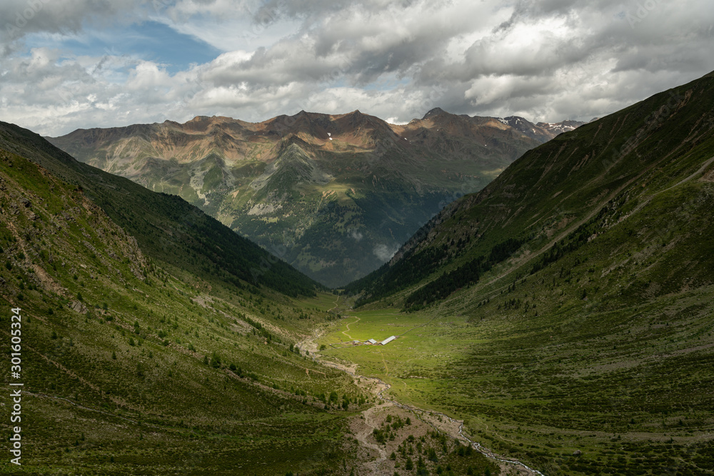 Valley and mountains near Ausserglies on a sunny day in summer Valley and mountains near Ausserglies on a sunny day in summer