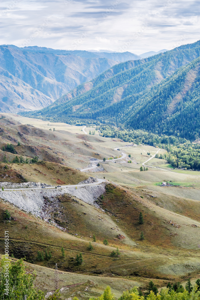 Serpentine mountain road. View of the Chuysky tract from the Chike-Taman pass, Altai mountains, Russia