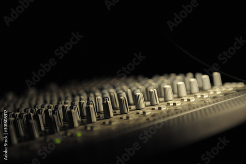 Close up on dj mixer in dark room. photo