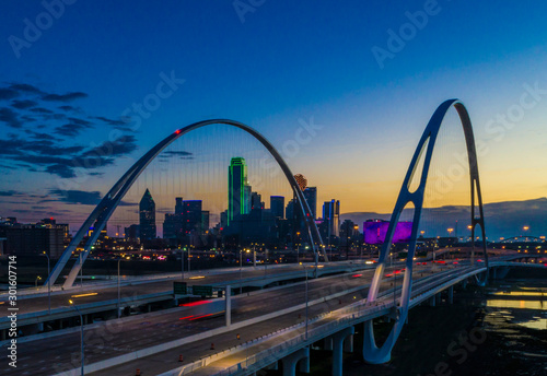 Dallas skyline at twilight over bridge photo