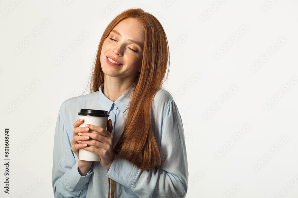 beautiful young woman with red hair with a drink in hand on a white background beautiful young woman with red hair with a drink in hand on a white background