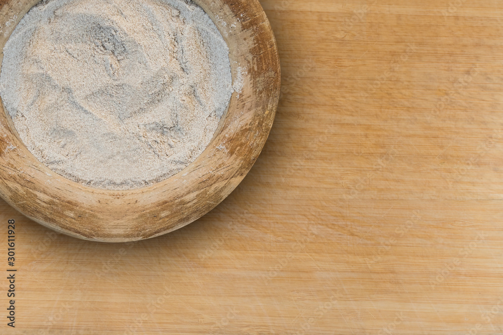 Teff flour in a wooden container Teff flour in a wooden container
