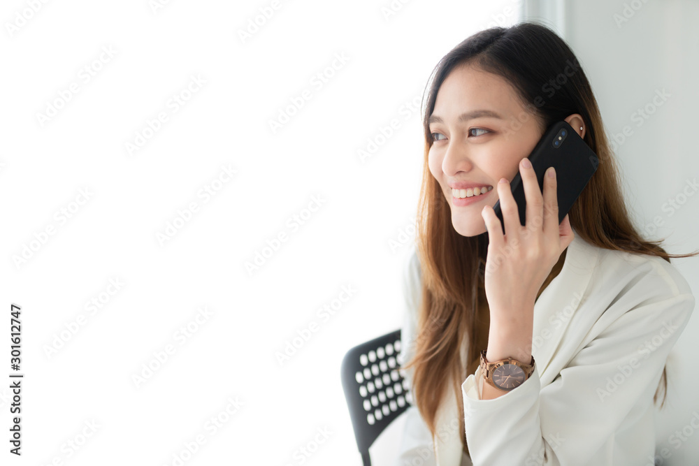 attractive asian officer holding smartphone and call with customer, she feeling relax and smile, communication technology attractive asian officer holding smartphone and call with customer, she feeling relax and smile, communication technology