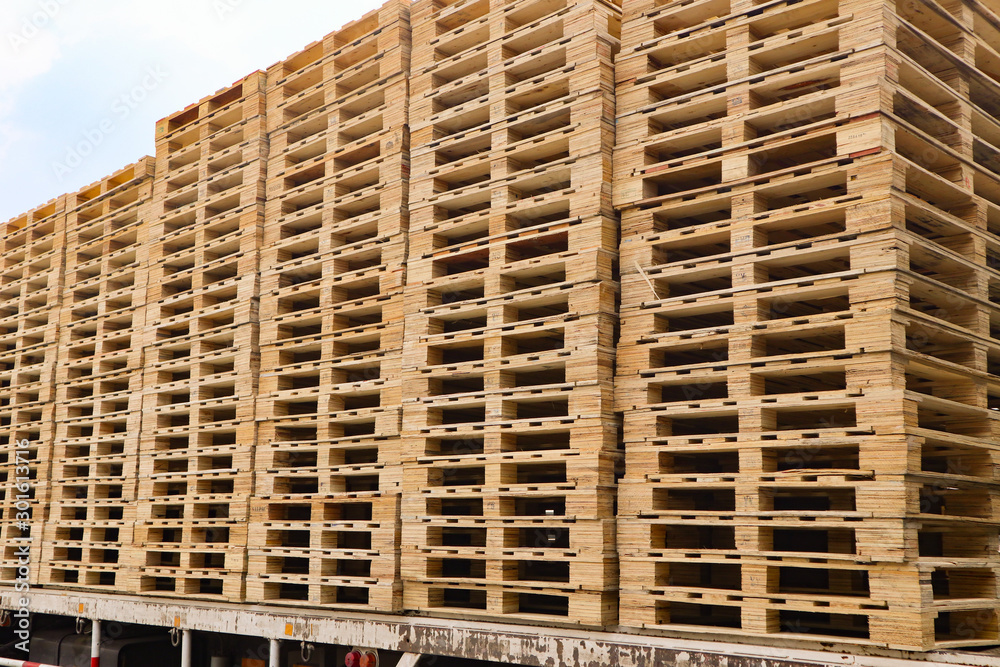 Wooden pallets stack at the freight cargo warehouse for transportation and logistics industrial