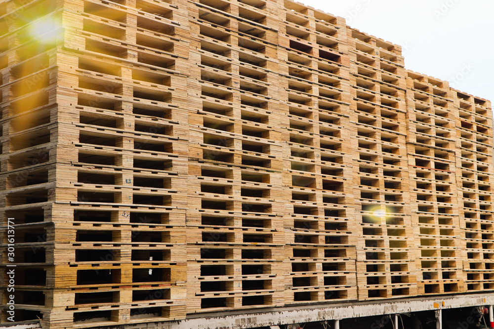 Wooden pallets stack at the freight cargo warehouse for transportation and logistics industrial Wooden pallets stack at the freight cargo warehouse for transportation and logistics industrial