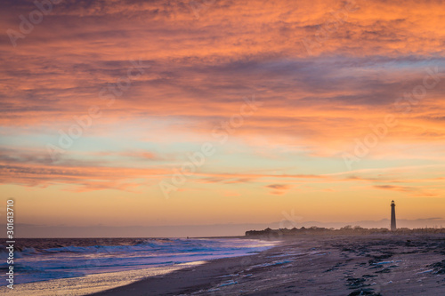 Cape May NJ lighthouse and Atlantic Ocean at sunset in springtime  © rabbitti