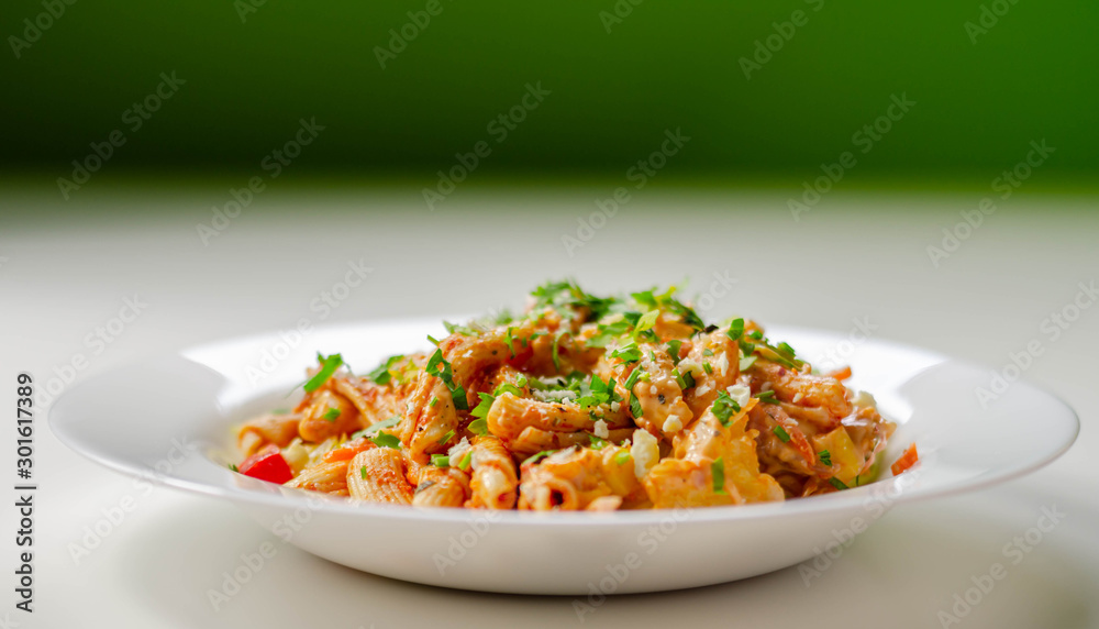 Piri piri style chicken on a bed of wholewheat pasta and vegetables, with a cool sour cream and chive dressing Piri piri style chicken on a bed of wholewheat pasta and vegetables, with a cool sour cream and chive dressing