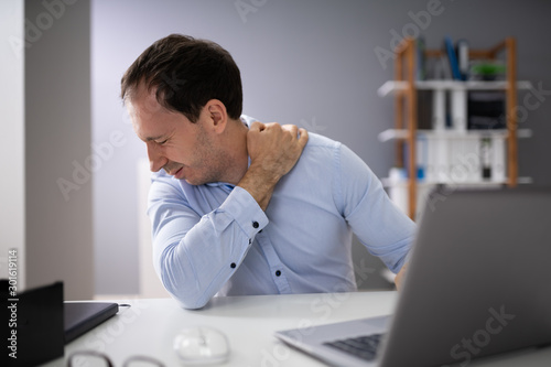 Businessman Having Neck Pain