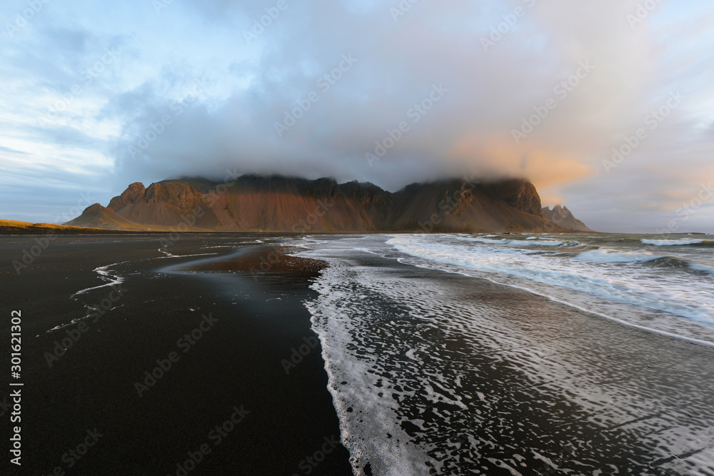 Magical landscape of Vestrahorn Mountains and Black sand dunes in Iceland  at sunrise. Panoramic view of the Stokksnes headland in a Colorful  seascape. Stock Photo | Adobe Stock