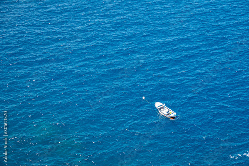 fishing boat viewed from above in a beautiful blue sea photo