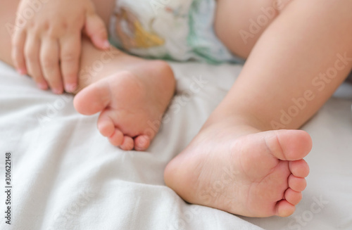 Legs of a two year old baby. The concept of healthy children's feet, legs. Soft focus, background. © Nataliya Smirnova