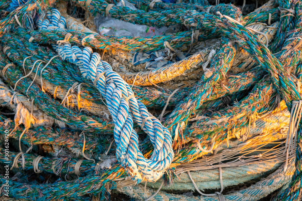 dirty old rope and nets for fishing on the dock