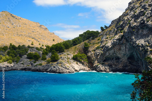 Beautiful famous bay of Sa Calobra on the island of Mallorca  Spain. Turquoise sea  rocks and pines. Travel to the Balearic Islands.