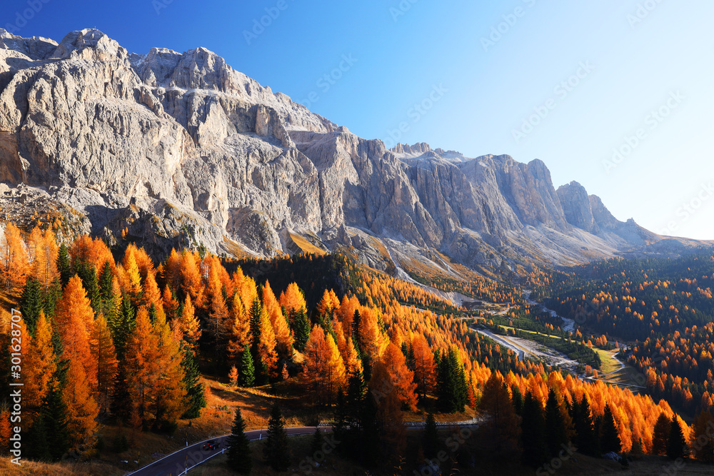 Amazing autumn view on Sassolungo mountain and Gardena Pass. Dolomite Alps, South Tyrol, Italy.