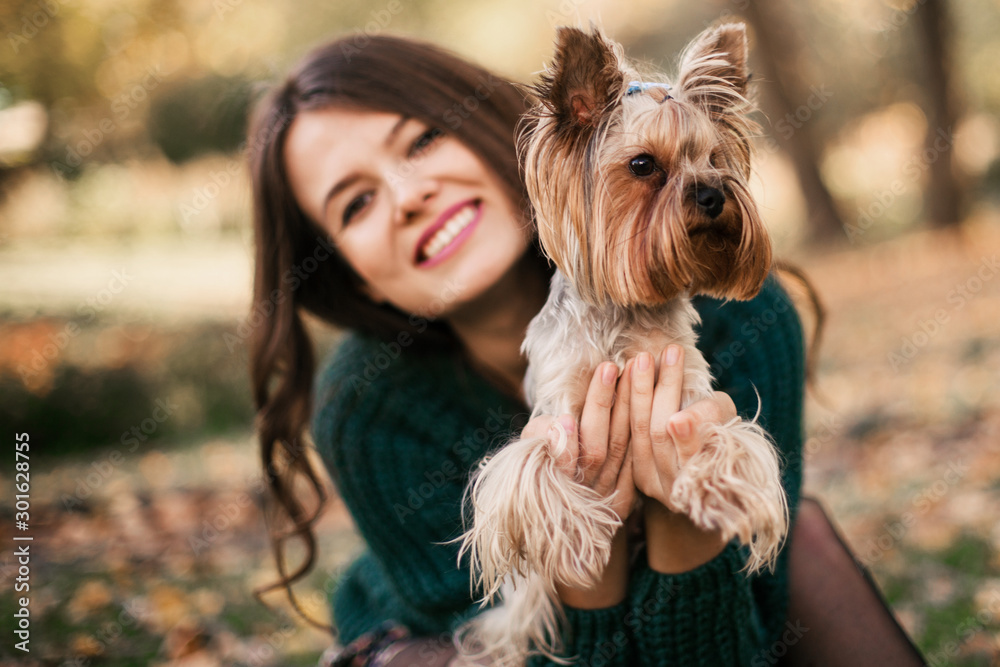 Beautiful woman playing with dog in the park Beautiful woman playing with dog in the park