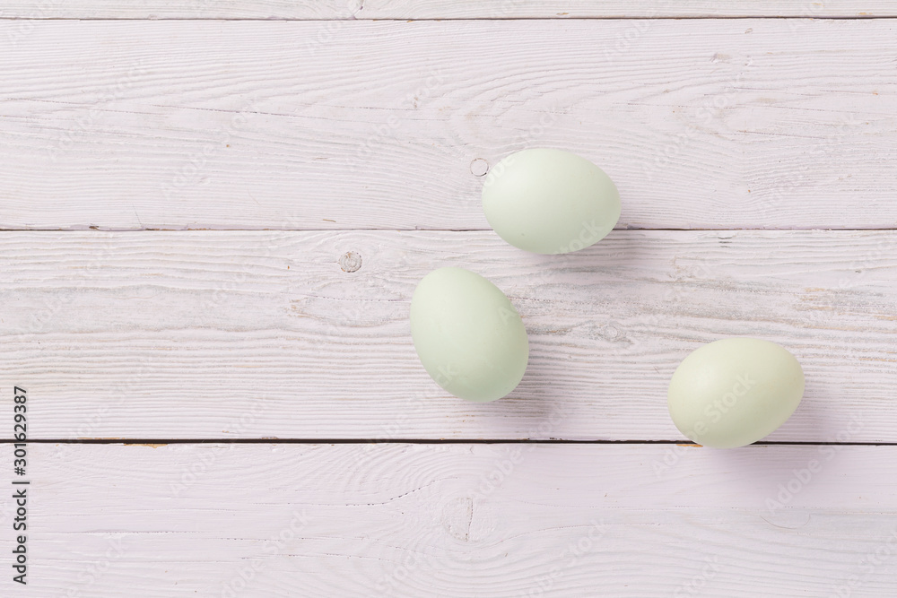 Three Blue Green Eggs on Wood background Three Blue Green Eggs on Wood background