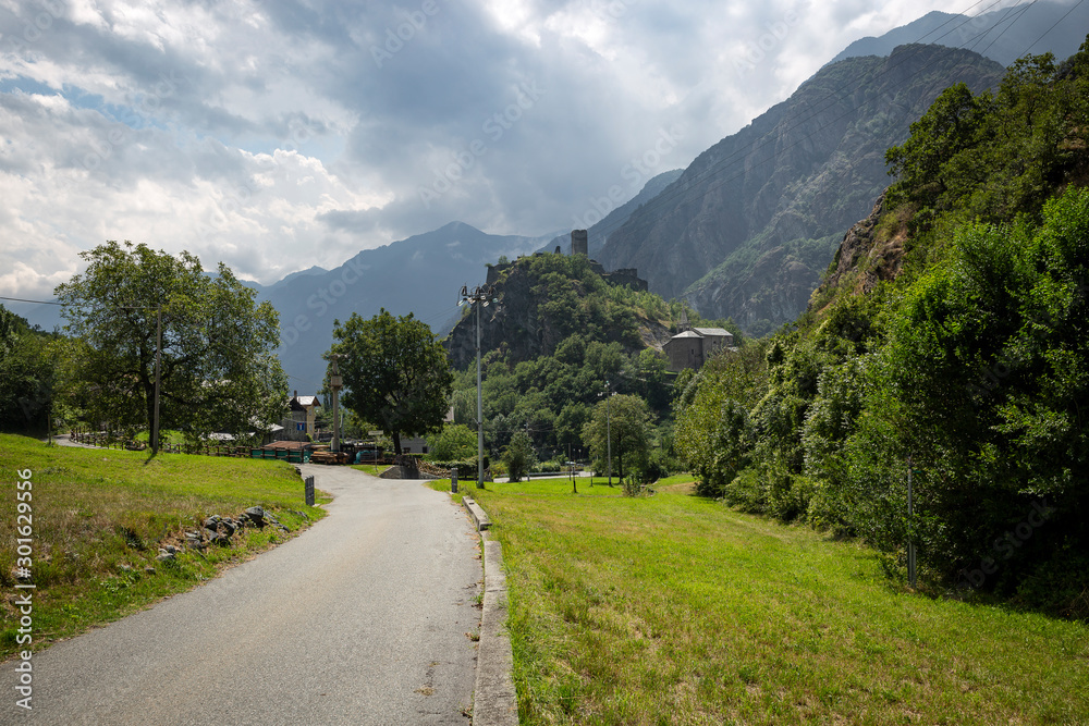 paved road passing through Provaney village (municipality of Montjovet), Aosta Valley, Italy