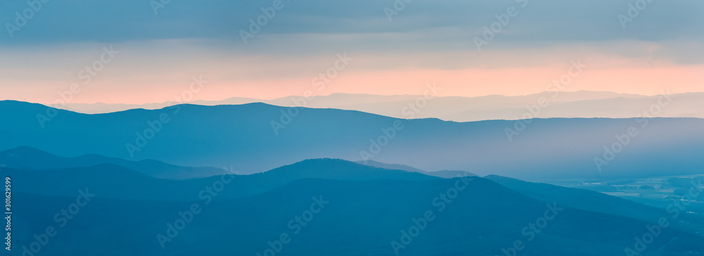 Sunset over the Shenandoah Valley as seen from an overlook on Skyline Drive in Shenandoah National Park. Sunset over the Shenandoah Valley as seen from an overlook on Skyline Drive in Shenandoah National Park.